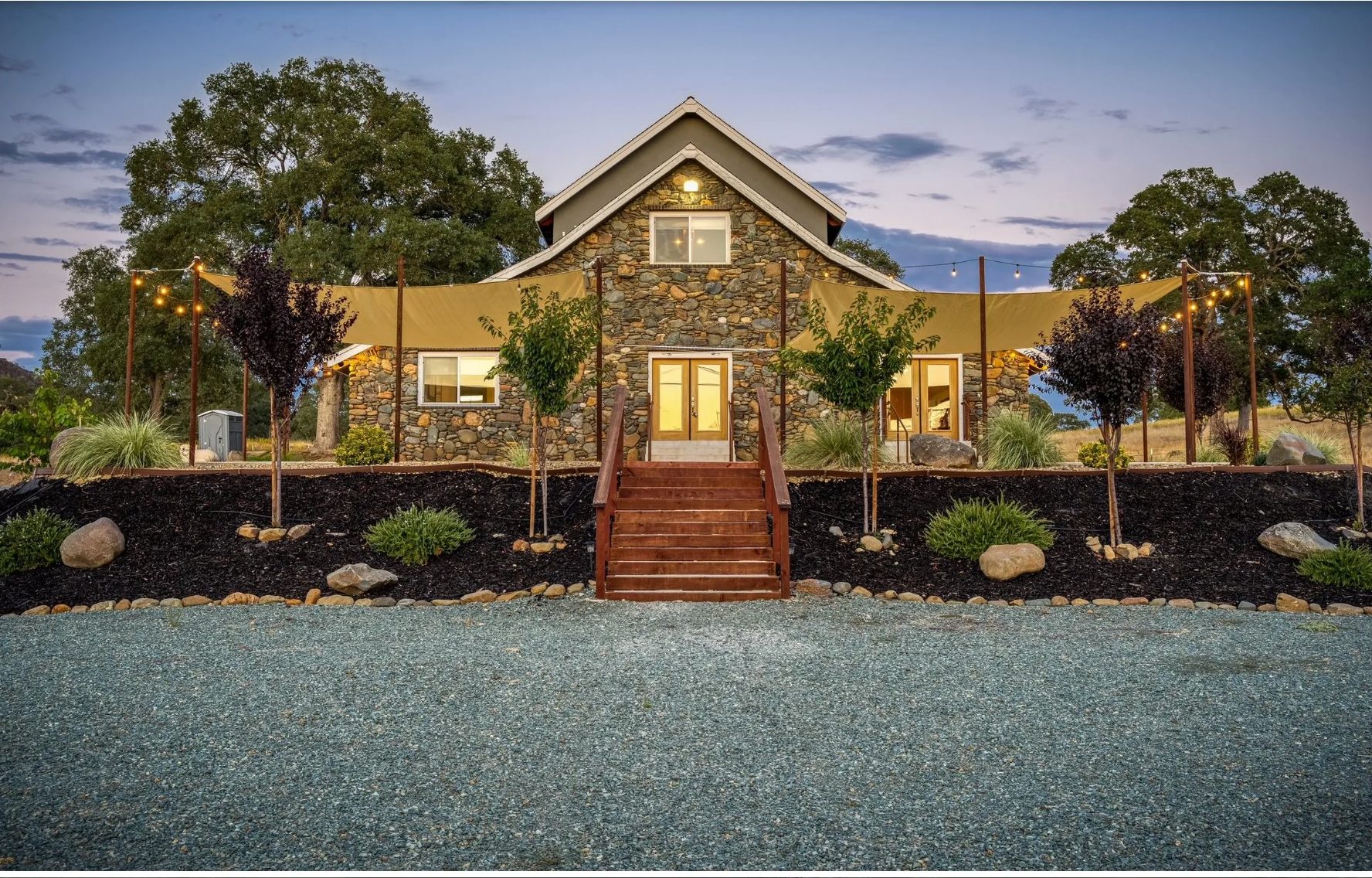 The Stone Barn at Cosumnes River Ranch set for a wedding at golden hour